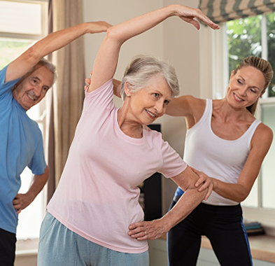 Seniors participating in a guided stretching exercise class.